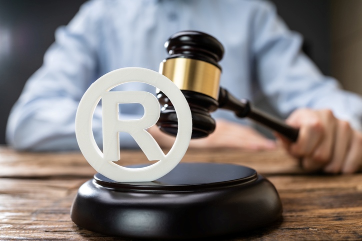 A gavel and a symbol on a table
AI-generated content may be incorrect.